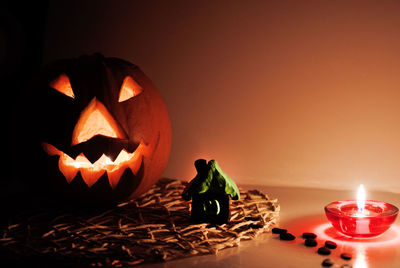 Illuminated candles on pumpkin during halloween