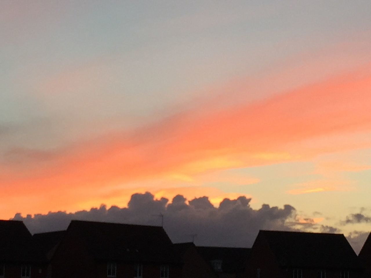 building exterior, sunset, architecture, built structure, sky, house, low angle view, orange color, silhouette, cloud - sky, residential structure, high section, beauty in nature, roof, scenics, nature, residential building, outdoors, cloud, no people