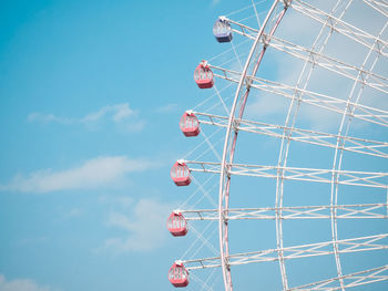 Low angle view of ferris wheel against sky