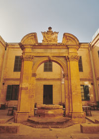 Low angle view of historic building against clear sky