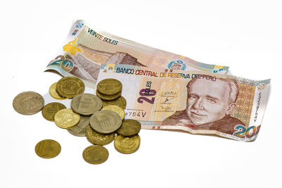 Close-up of coins against white background