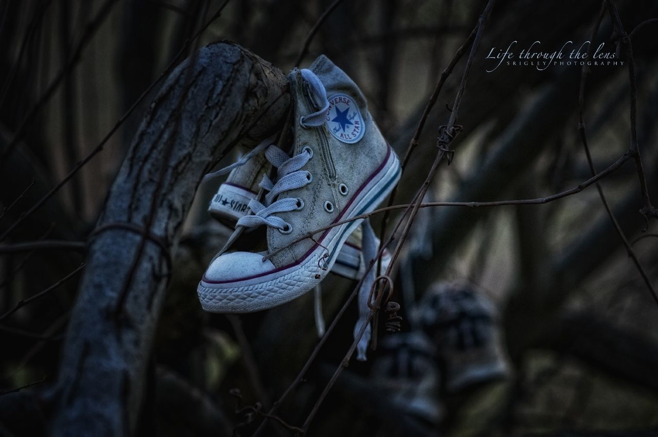 focus on foreground, close-up, selective focus, outdoors, shoe, blue, day, part of, hanging, men, unrecognizable person, rope, standing, low section, nature, footwear
