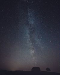 Scenic view of star field against sky at night