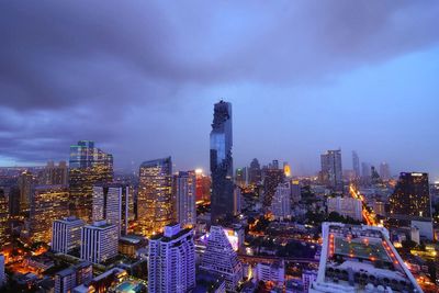 Cityscape against cloudy sky