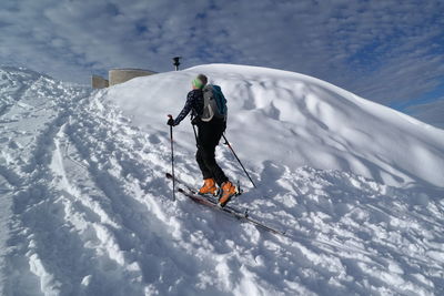 Person skiing on snow covered landscape