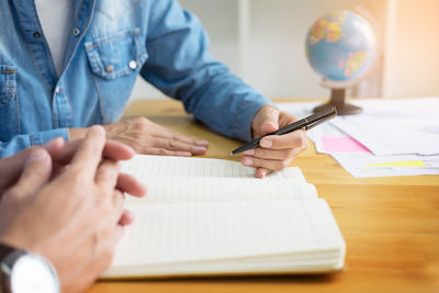Close-up of man working on table