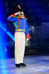 Rear view of woman standing on stage