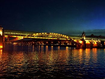 Bridge over river at night