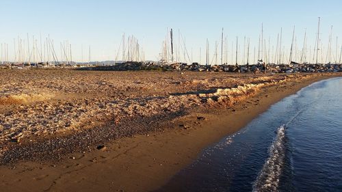 Scenic view of beach against clear sky