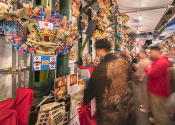 Group of people at market stall