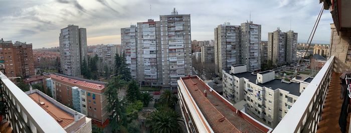 High angle view of buildings in city against sky