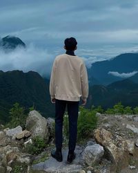 Man standing on top of mountain