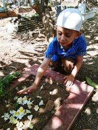 High angle view of boy standing on field