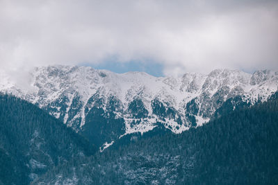 Scenic view of mountains against sky during winter