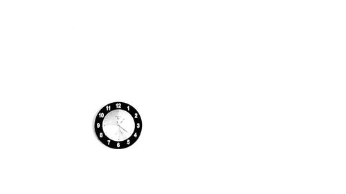 Close-up of clock against white background