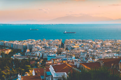 High angle view of cityscape against lake