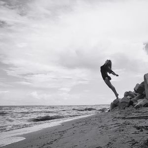 Scenic view of sea against cloudy sky