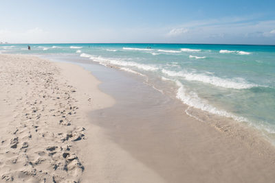 Scenic view of beach against sky