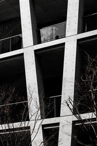 Low angle view of broken glass window of old building