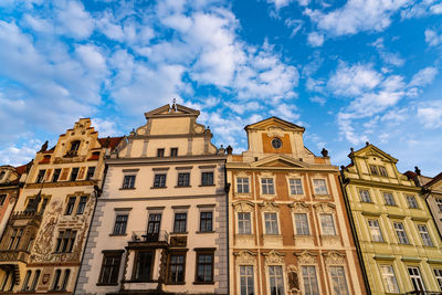 Low angle view of old town buildings in prague against cloudy sky