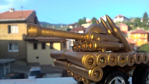 Close-up of gold colored bullets representating military tank