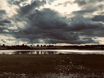 Scenic view of sea against cloudy sky