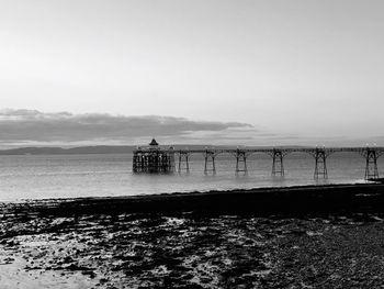 Pier in sea against sky