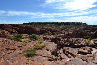 Rock formations on landscape against sky