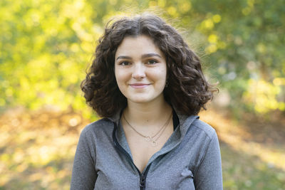 Portrait of young woman in park