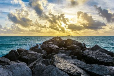 Scenic view of sea against cloudy sky