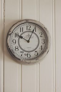 Close-up of clock on wall