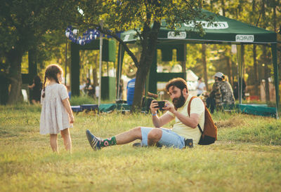 Young couple sitting in park
