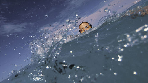 Portrait of woman swimming in sea