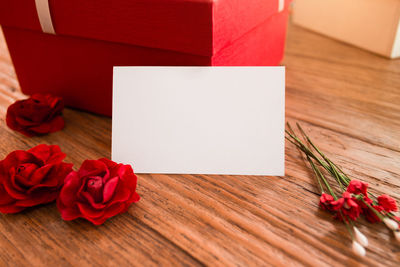 Close-up of red rose on table