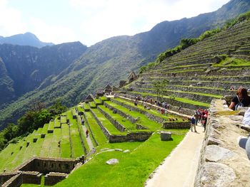 Panoramic view of green landscape against sky