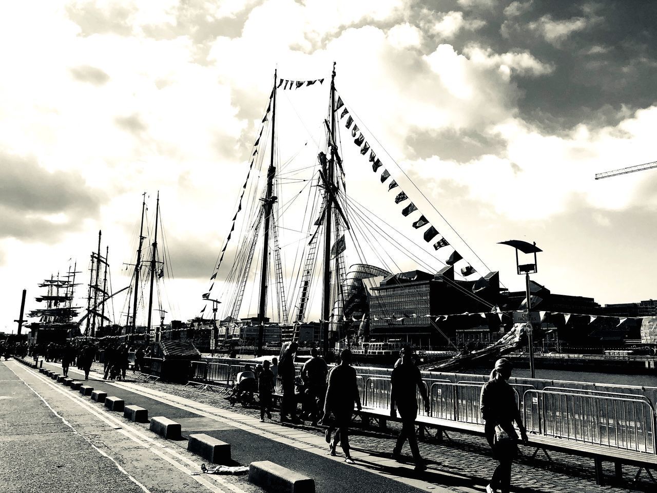 PEOPLE WALKING ON RAILWAY BRIDGE