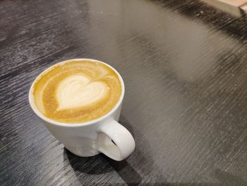 High angle view of cappuccino on table