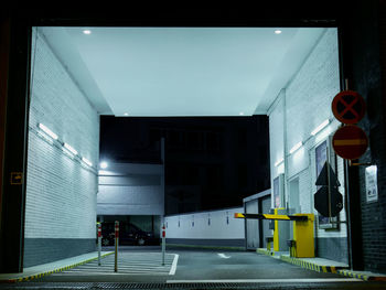 Empty road along buildings