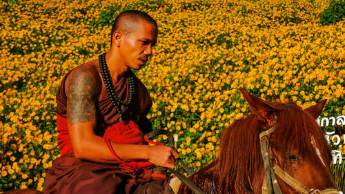 Mid adult man sitting on horse
