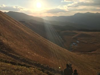 Scenic view of landscape against sky during sunset