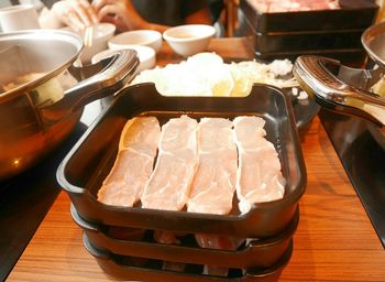 Close-up of meat in containers on table