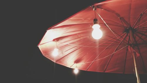 Low angle view of illuminated light bulb