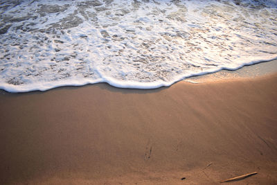 White wave of blue sea on sandy beach. natural background