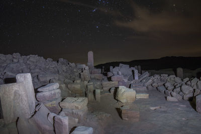 Panoramic view of rocks at night