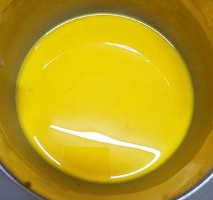 Directly above shot of yellow drink on table