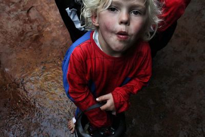 High angle view of boy dressed as spiderman