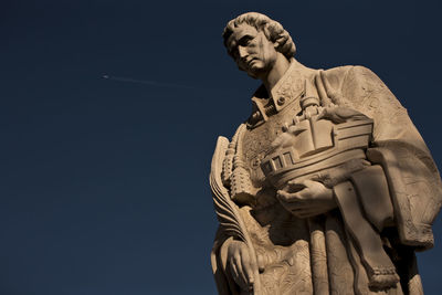 Low angle view of statue against clear sky