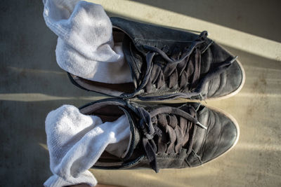 Low section of shoes on table