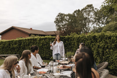 Friends having meal in garden