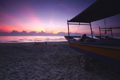 Scenic view of beach against sky during sunset